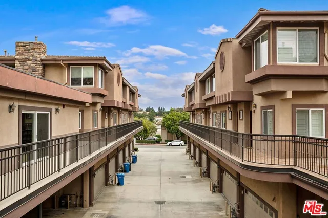 a view of a house with iron stairs