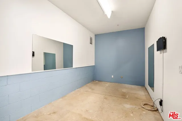 a front view of a building with potted plants