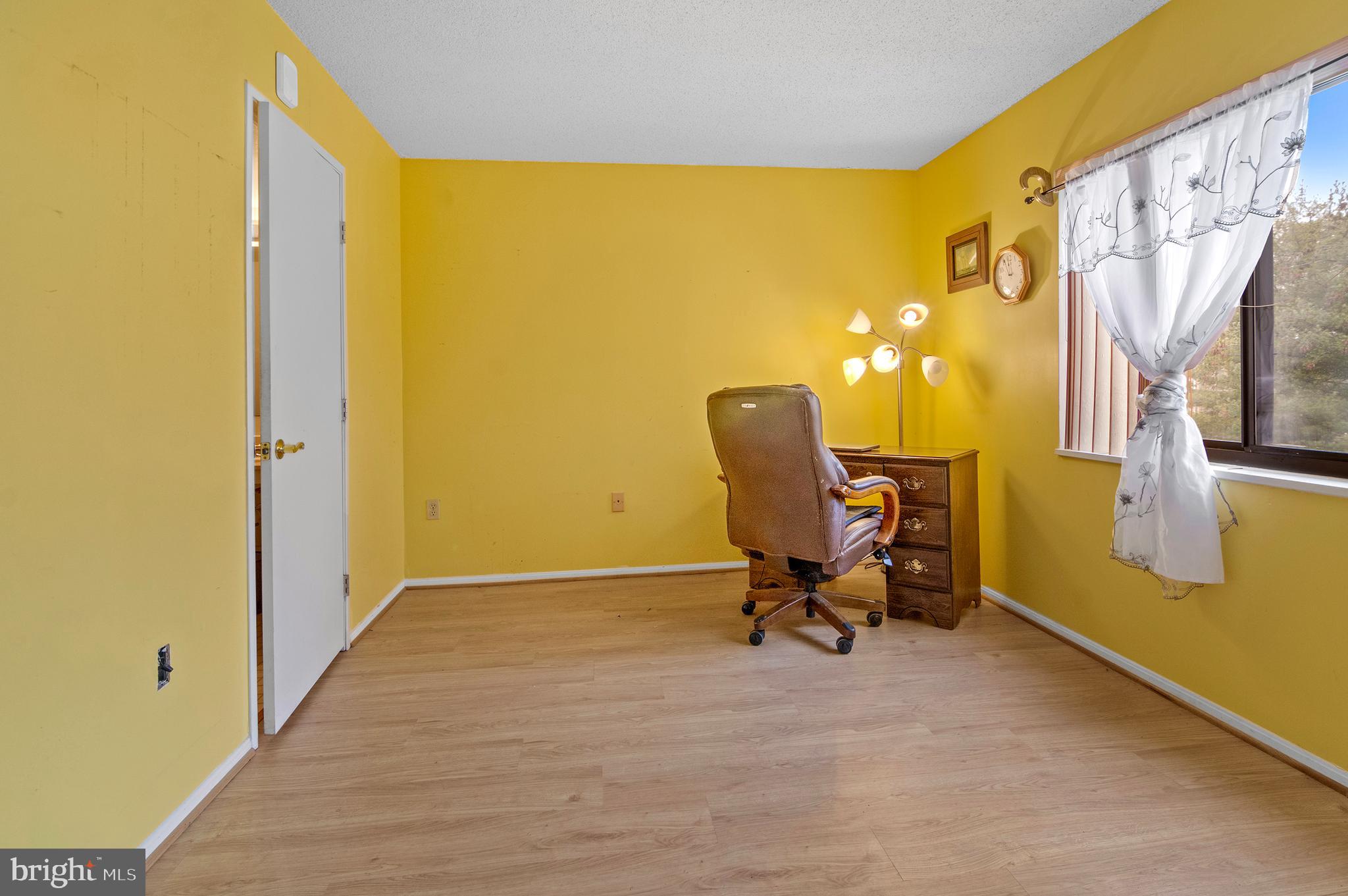 15115 Interlachen Drive, Unit 3506 Silver Spring, MD 20906 - Photo 15 of 27 a view of a room with furniture and a window
