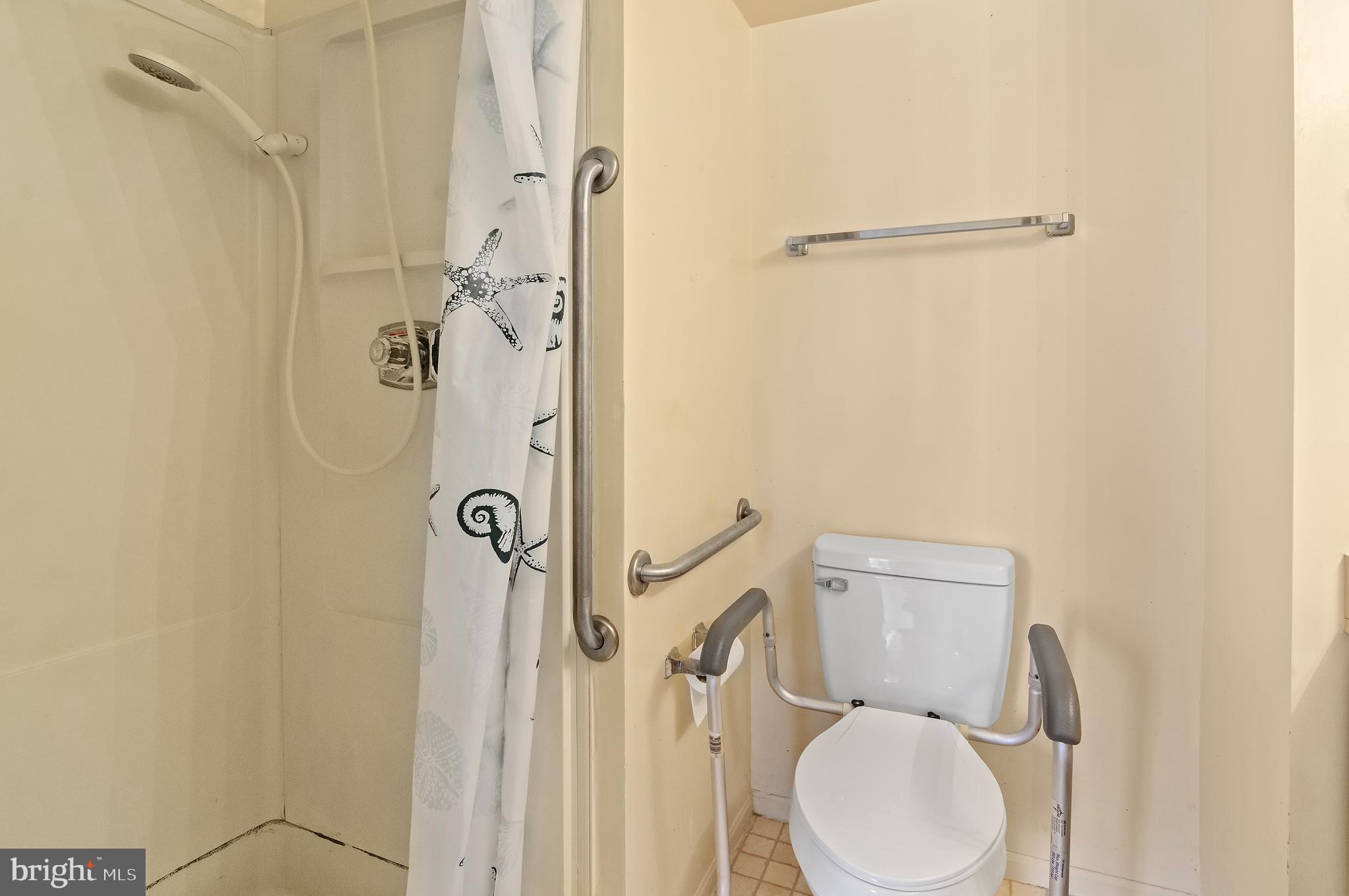15115 Interlachen Drive, Unit 3506 Silver Spring, MD 20906 - Photo 16 of 27 a bathroom with a toilet and shower