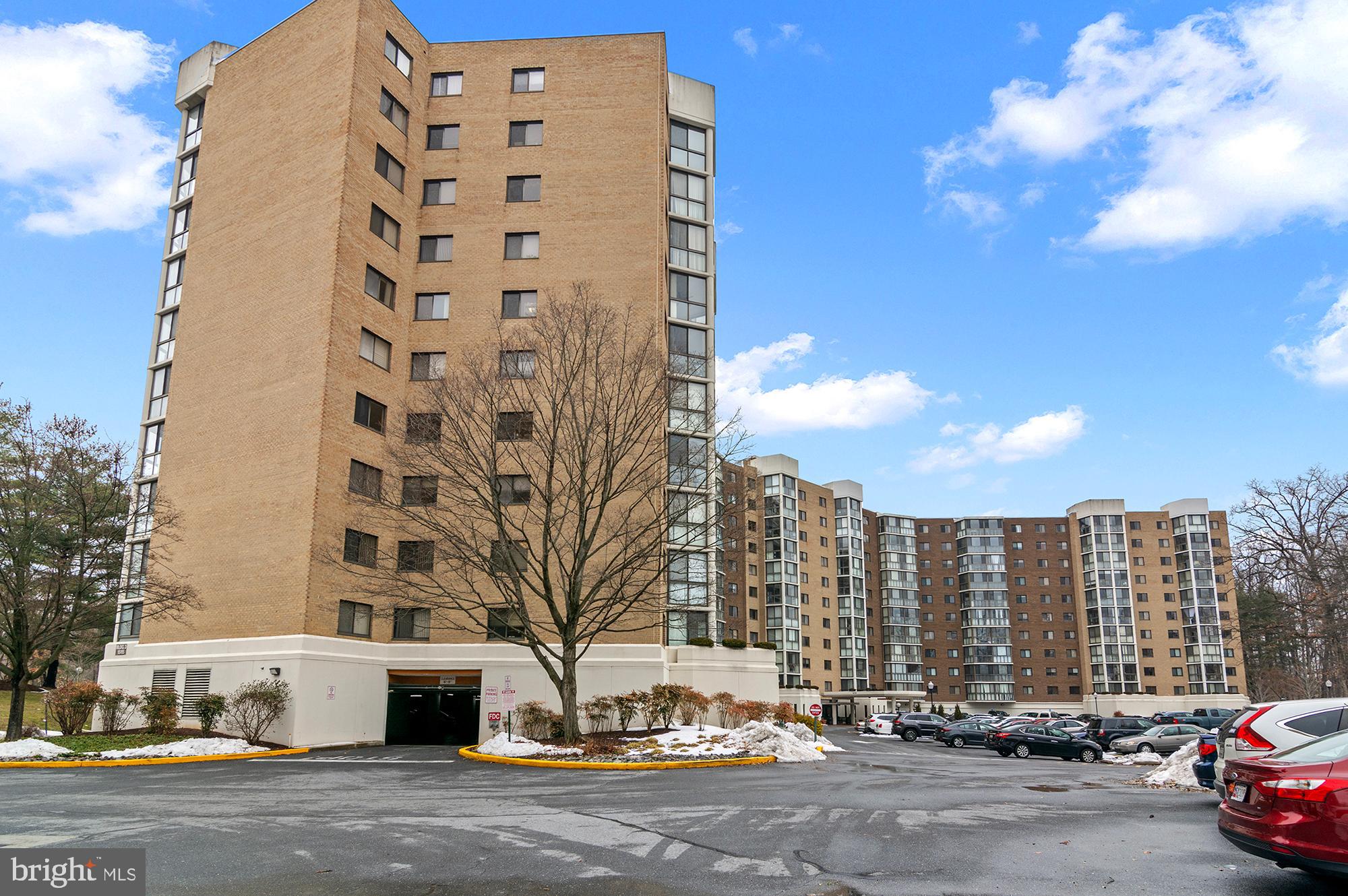 15115 Interlachen Drive, Unit 3506 Silver Spring, MD 20906 - Photo 18 of 27 a city street lined with tall buildings
