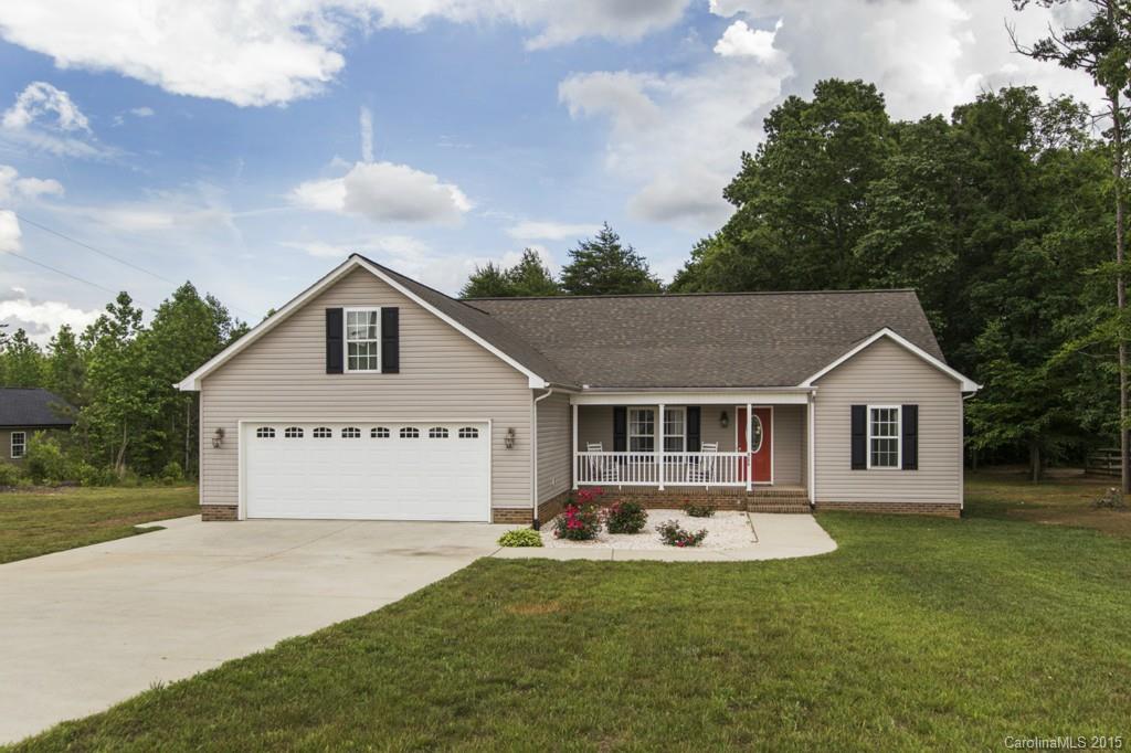 3474 Mack Ballard Road Maiden, NC 28650 - Photo 1 of 24 a front view of a house with a garden and yard