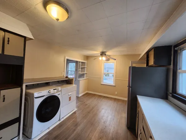a view of a kitchen with washer and dryer