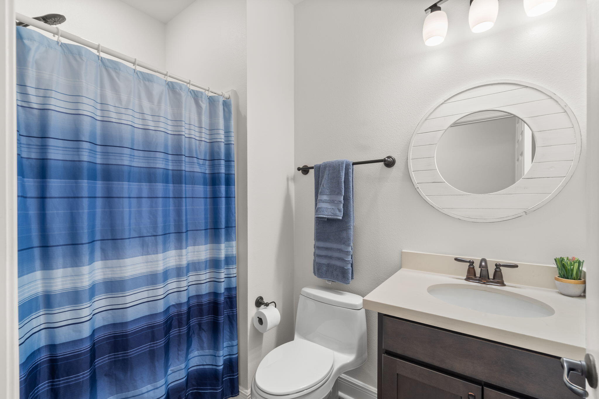 369 Brushed Dune Circle Freeport, FL 32439 - Photo 25 of 63 a bathroom with a sink a toilet and a mirror