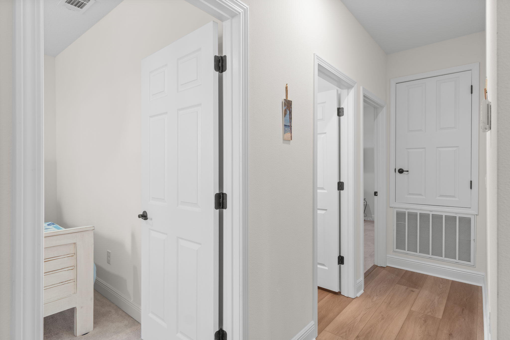 369 Brushed Dune Circle Freeport, FL 32439 - Photo 26 of 63 a view of a hallway with wooden floor