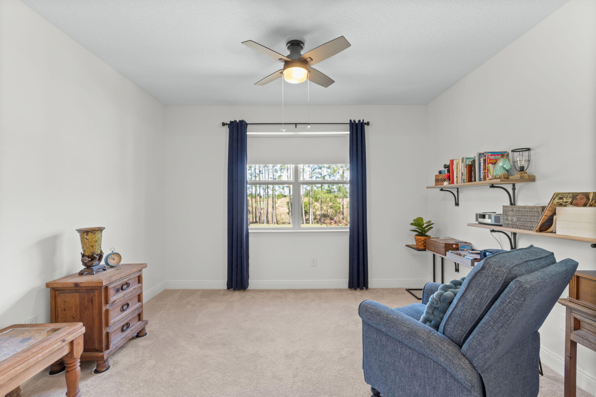 369 Brushed Dune Circle Freeport, FL 32439 - Photo 35 of 63 a living room with furniture and a window