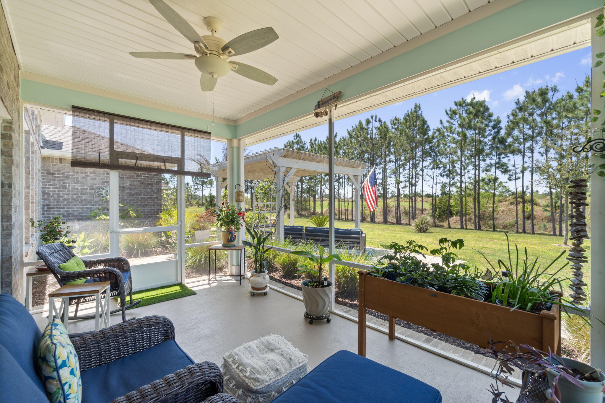 369 Brushed Dune Circle Freeport, FL 32439 - Photo 43 of 63 a living room with patio furniture and a potted plant