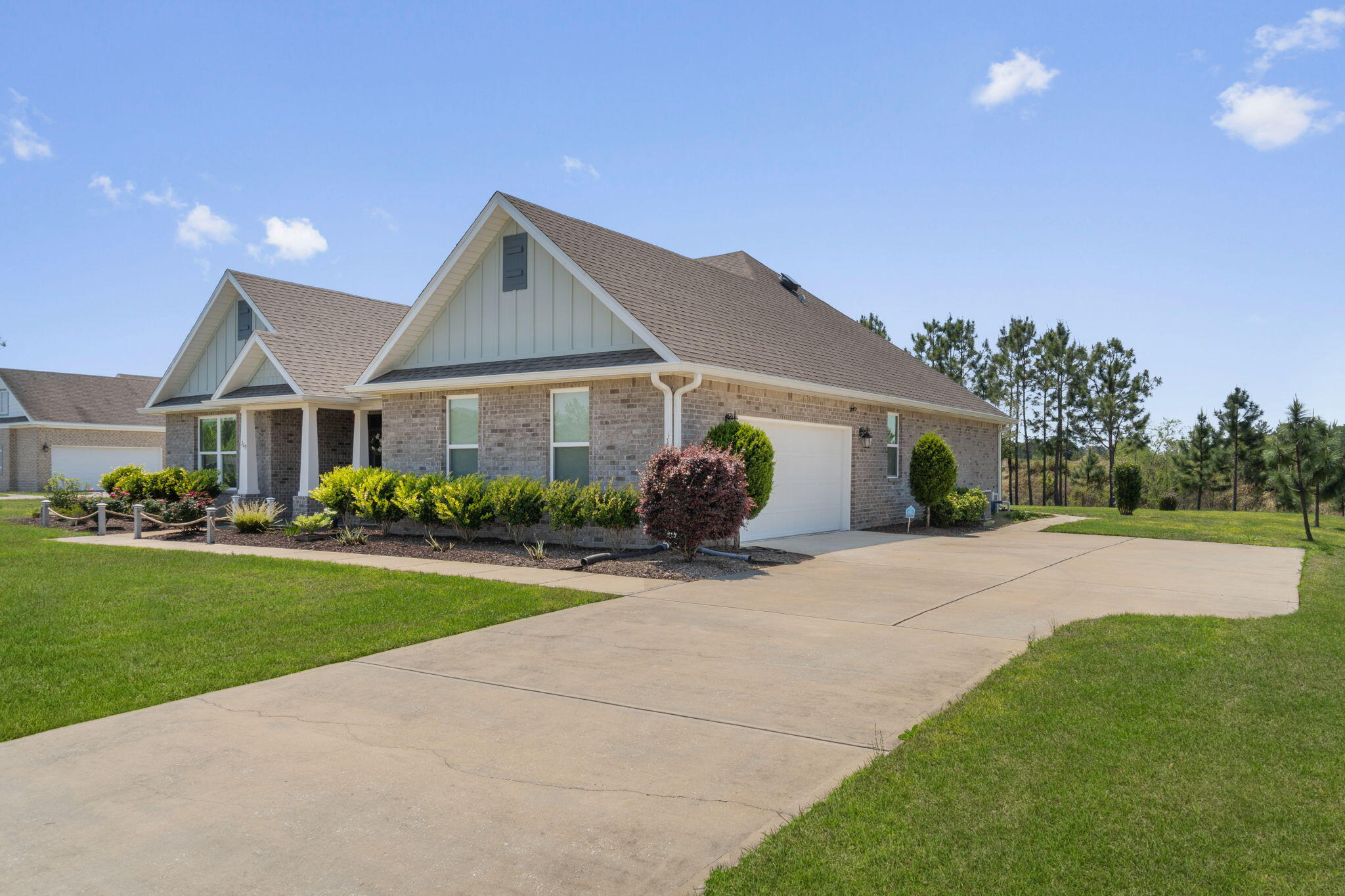 369 Brushed Dune Circle Freeport, FL 32439 - Photo 5 of 63 a front view of a house with a yard and garage