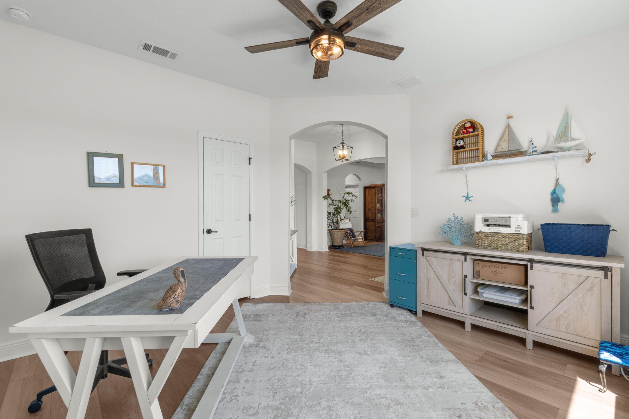 369 Brushed Dune Circle Freeport, FL 32439 - Photo 9 of 63 a view of livingroom and kitchen with furniture wooden floor and window