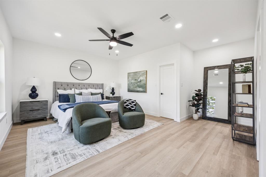 2516 Sunridge Road Carrollton, TX 75006 - Photo 11 of 39 a bed room with a bed and a chair