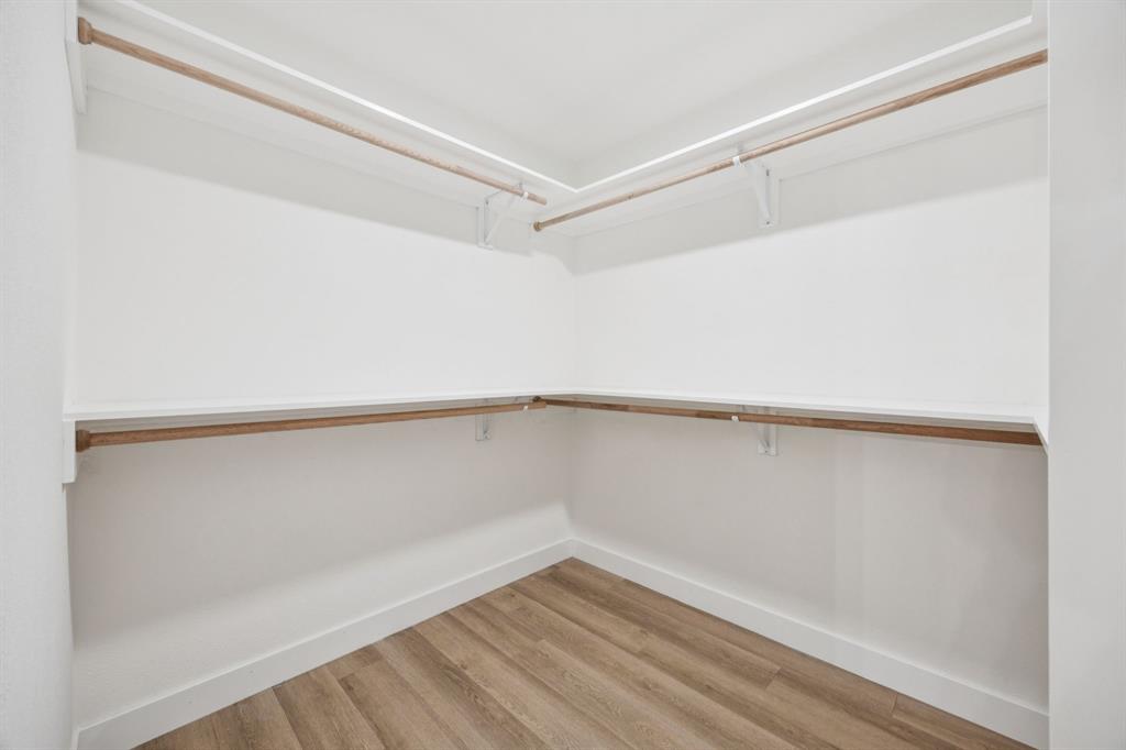 2516 Sunridge Road Carrollton, TX 75006 - Photo 20 of 39 a view of an empty walk in closet