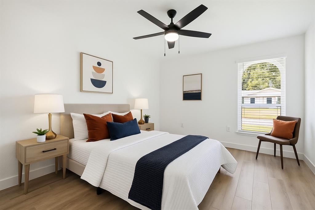 2516 Sunridge Road Carrollton, TX 75006 - Photo 23 of 39 a bedroom with a bed and a chair