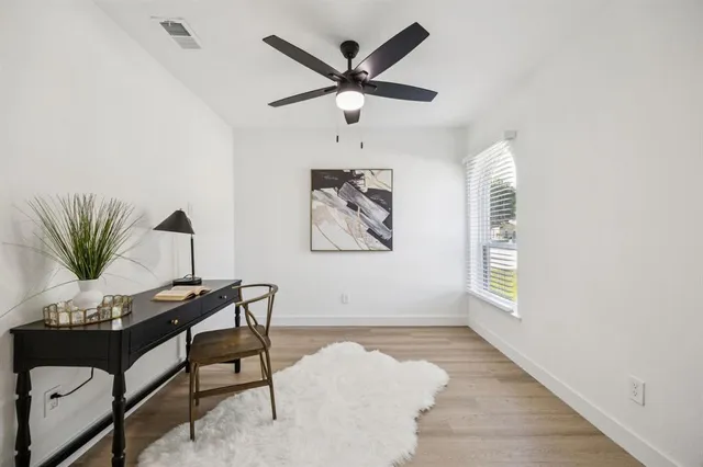 a view of workspace with wooden floor