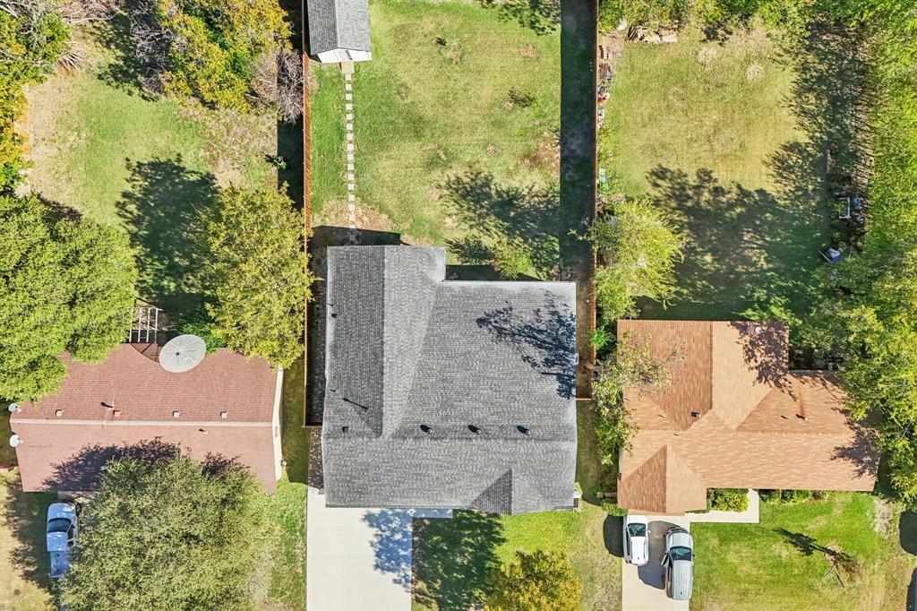2516 Sunridge Road Carrollton, TX 75006 - Photo 31 of 39 an aerial view of residential houses with outdoor space and trees