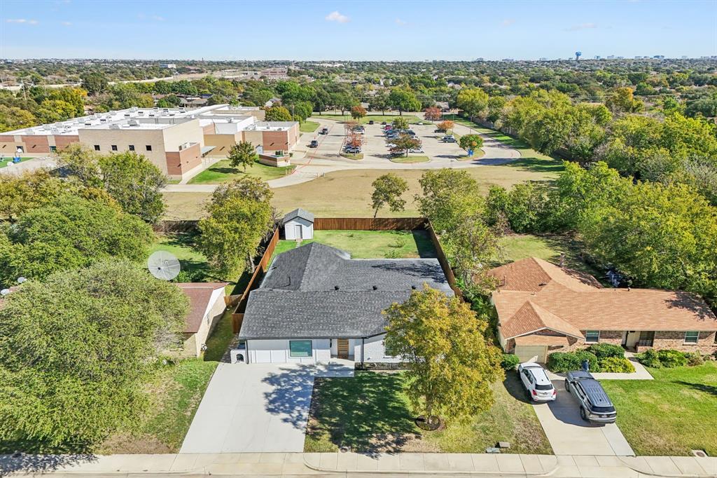 2516 Sunridge Road Carrollton, TX 75006 - Photo 32 of 39 an aerial view of residential houses with outdoor space and swimming pool