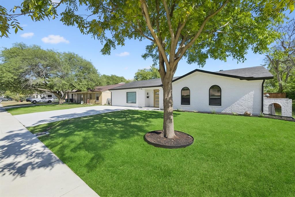 2516 Sunridge Road Carrollton, TX 75006 - Photo 38 of 39 a house that has garden in front of it