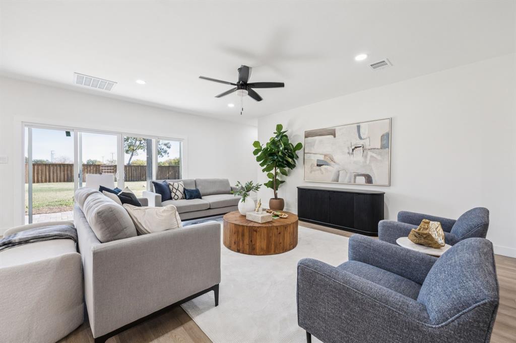 2516 Sunridge Road Carrollton, TX 75006 - Photo 7 of 39 a living room with furniture and a large window