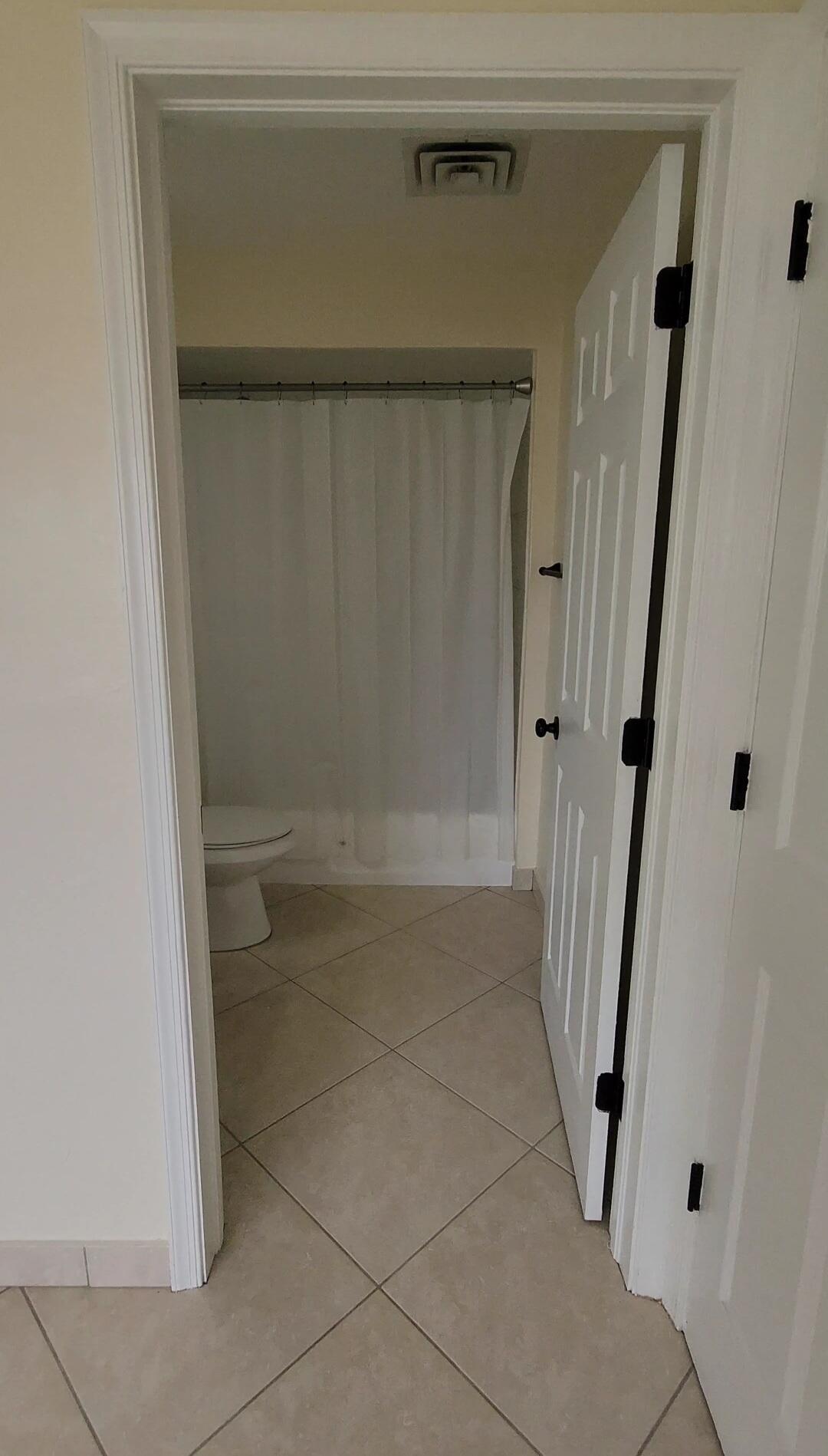 105 South Riverside Drive, Unit 302 Pompano Beach, FL 33062 - Photo 25 of 37 a bathroom with a glass door shower
