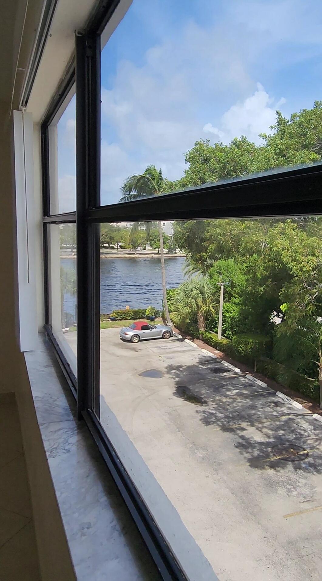 105 South Riverside Drive, Unit 302 Pompano Beach, FL 33062 - Photo 27 of 37 a view of a large window with an outdoor space