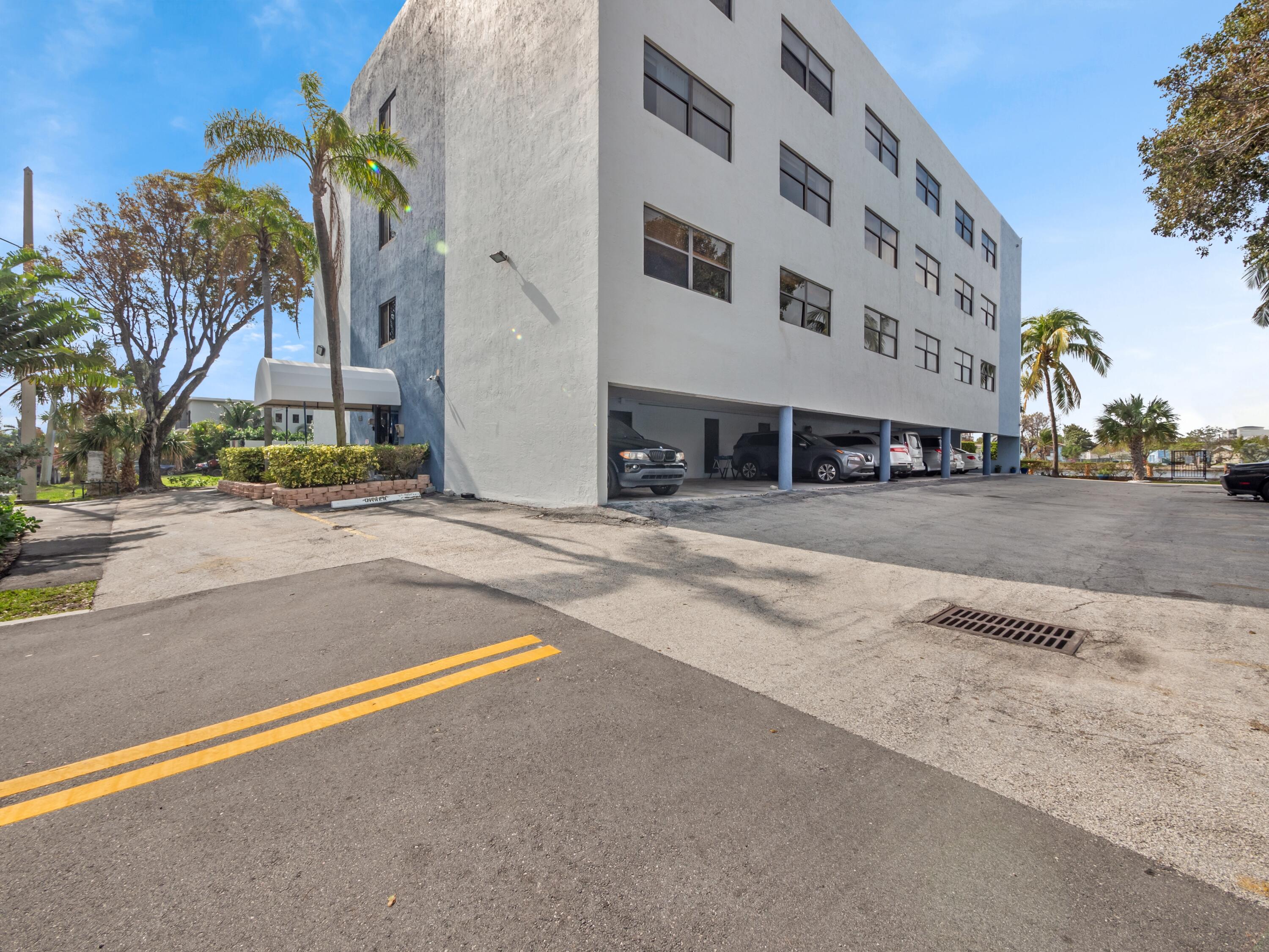 105 South Riverside Drive, Unit 302 Pompano Beach, FL 33062 - Photo 32 of 37 a view of a building with a street