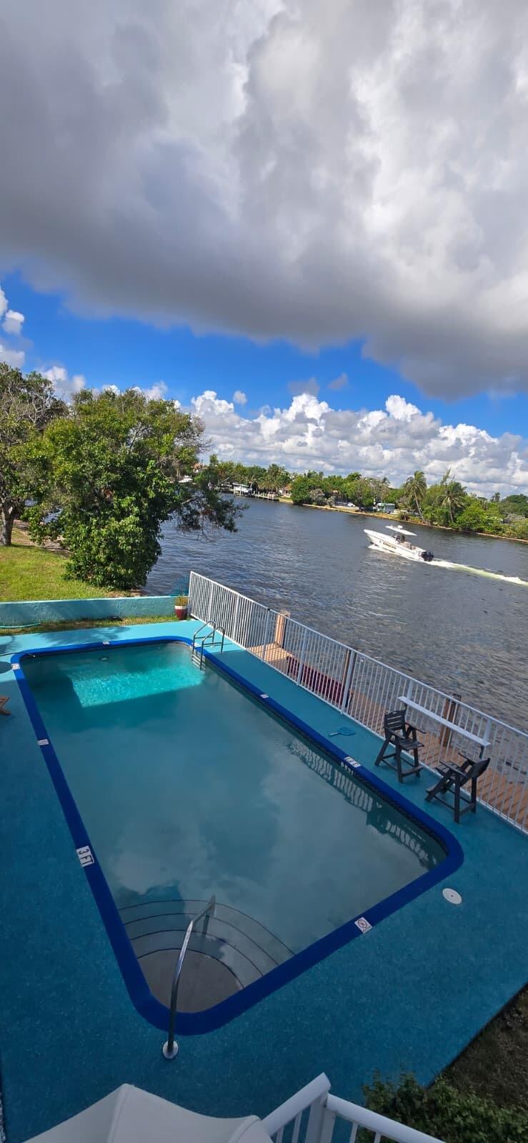 105 South Riverside Drive, Unit 302 Pompano Beach, FL 33062 - Photo 35 of 37 a view of a lake from a balcony