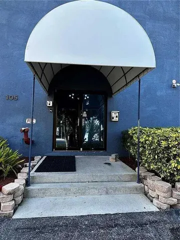 a view of living room with wooden floor