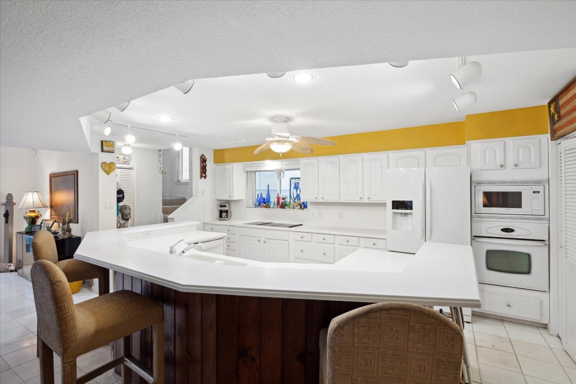 251 Isles End Road Tiki Island, TX 77554 - Photo 11 of 23 oversized kitchen with open views