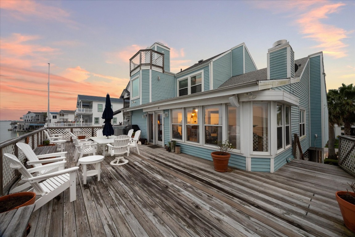 251 Isles End Road Tiki Island, TX 77554 - Photo 20 of 23 oversized deck to enjoy entertaining dinners with family and friends