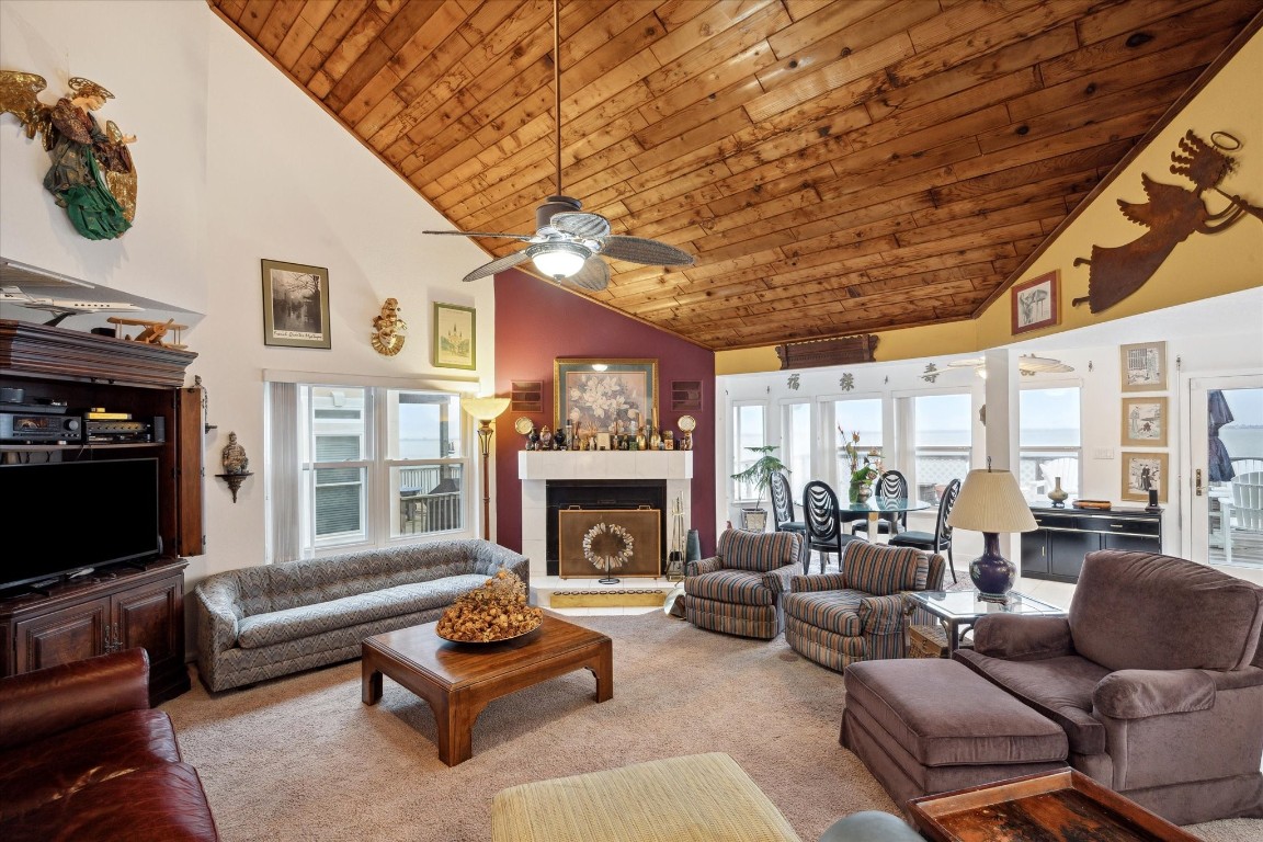 251 Isles End Road Tiki Island, TX 77554 - Photo 6 of 23 family room with highceilings and lots of water view windos