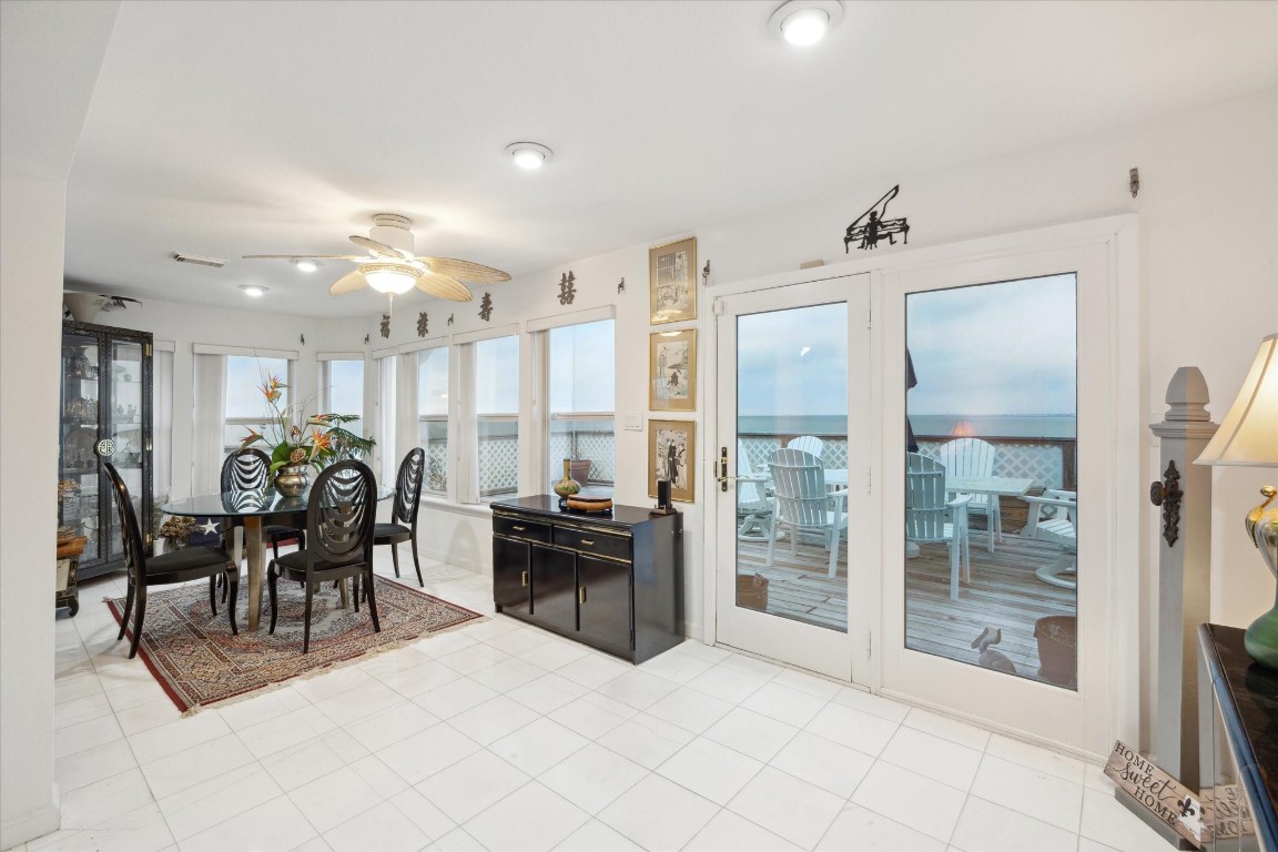 251 Isles End Road Tiki Island, TX 77554 - Photo 10 of 23 large dining room can also be a piano room, office or dining table to seat 16