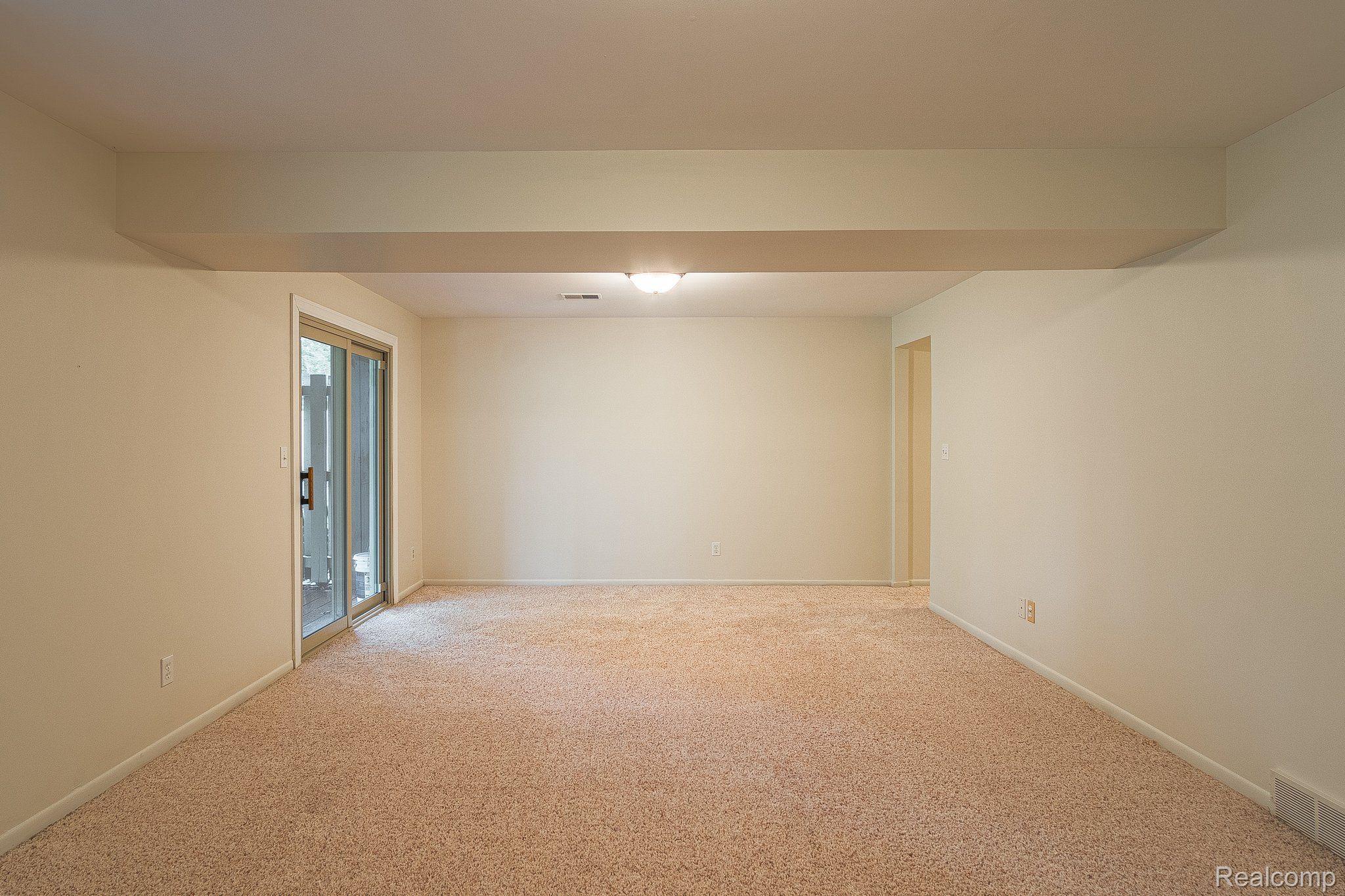 205 George Street Flushing, MI 48433 - Photo 31 of 40 Lower level family room w/walkout access