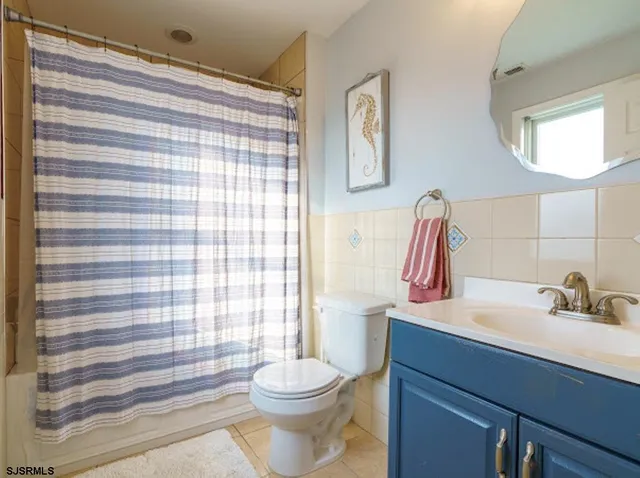 a view of a bedroom with furniture and rug