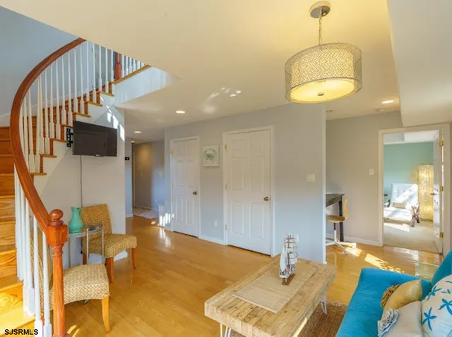 a bedroom with furniture and a chandelier