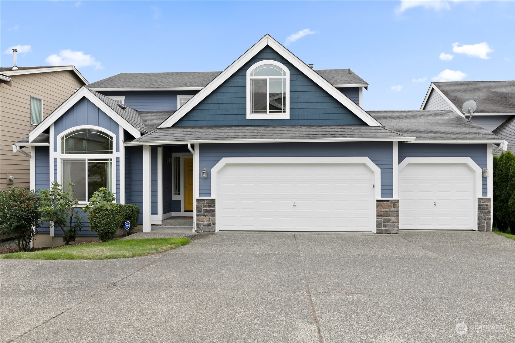 5209 Northeast 5th Court Renton, WA 98059 - Photo 1 of 28 a front view of a house with garden