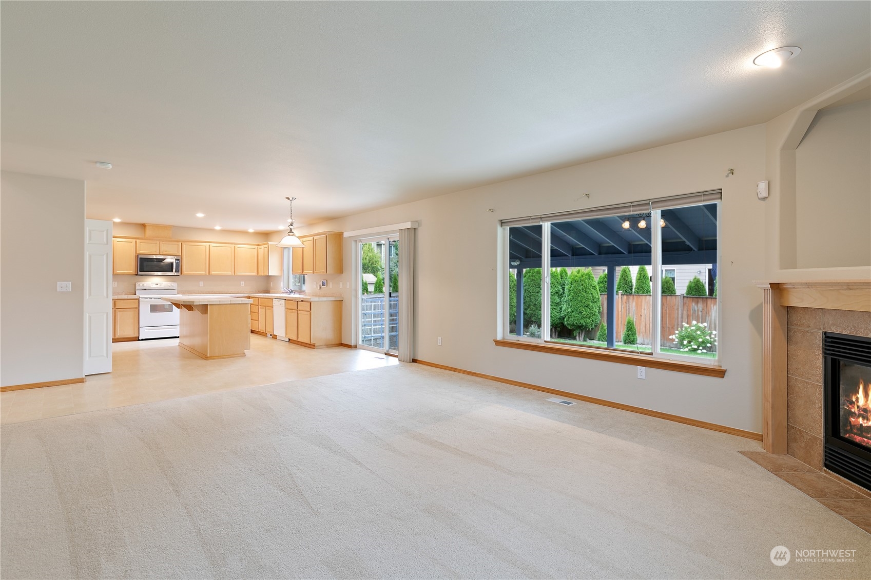 5209 Northeast 5th Court Renton, WA 98059 - Photo 11 of 28 a view of a big room with windows and a kitchen