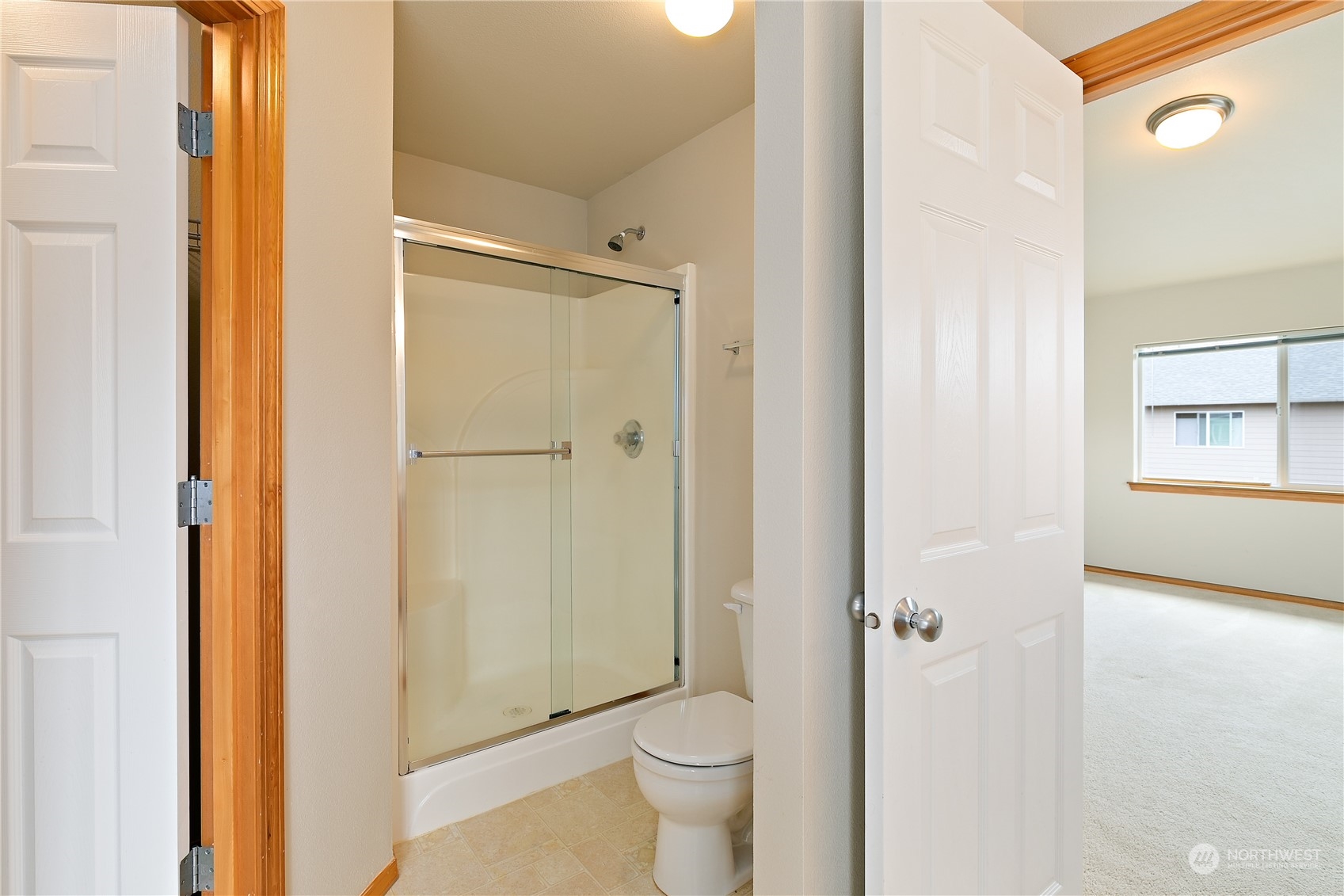 5209 Northeast 5th Court Renton, WA 98059 - Photo 15 of 28 a bathroom with a shower and a toilet