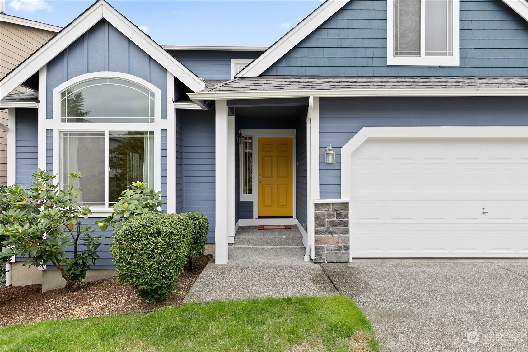 5209 Northeast 5th Court Renton, WA 98059 - Photo 2 of 28 a front view of a house with garden