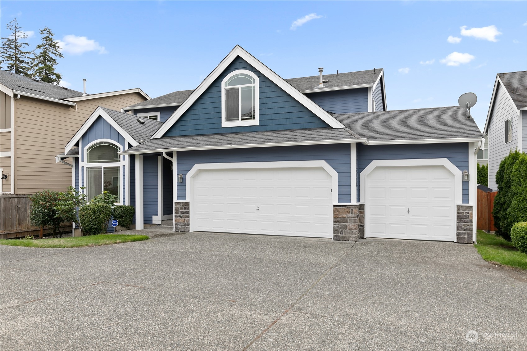 5209 Northeast 5th Court Renton, WA 98059 - Photo 27 of 28 a front view of a house with a yard and garage