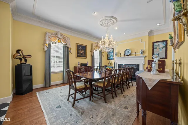 a large kitchen with stainless steel appliances granite countertop a stove and a wooden cabinets