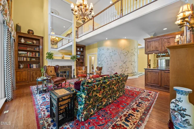 a living room with furniture and a chandelier