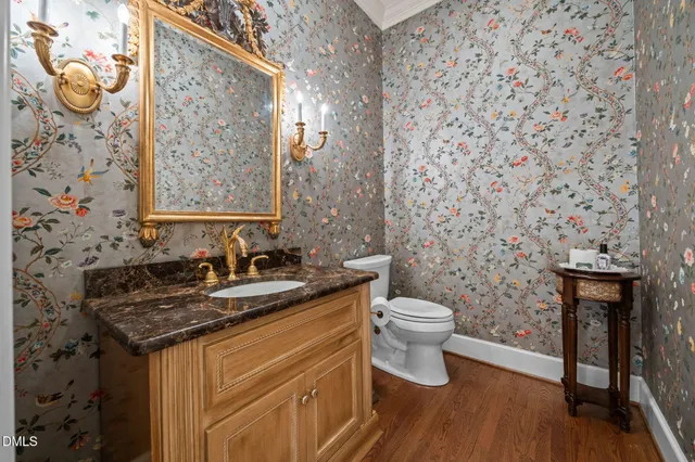 a living room with furniture a chandelier and a large window