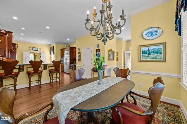 a bedroom with a bed dresser and window