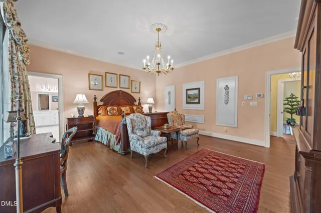 a bathroom with a toilet a sink a mirror a window and vanity