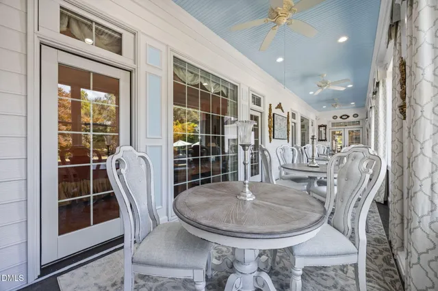 a living room filled with furniture and a window