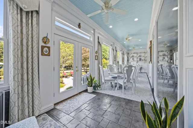 a bedroom with two beds and a chandelier