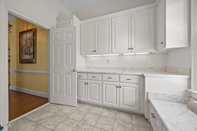 a view of a lake with a house in the background