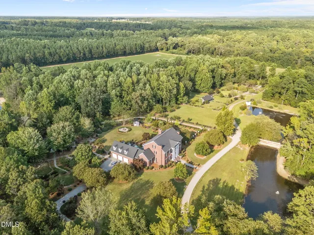 a front view of brick house with a yard