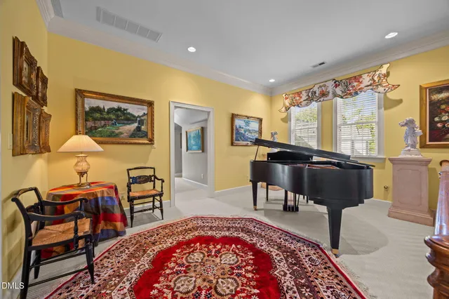 a view of a house with wooden fence and floor