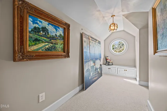 an aerial view of a house with a swimming pool