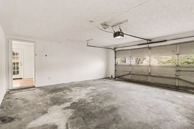 a view of backyard space with wooden fence